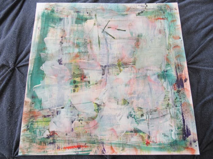 I always keep a piece of reasonably heavy 12" x 12" white card stock near my work area. I use a left over credit or gift card or a spatula to take any left over inks or media. Use these for art journal or scrapbook pages