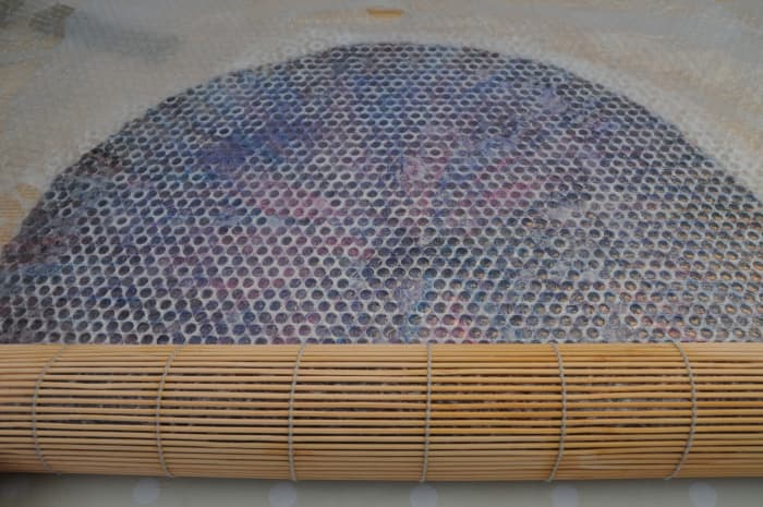 Alternatively, Sandwich the Entire Project Inside a Bamboo Blind: A bamboo blind makes light work of the felting process!