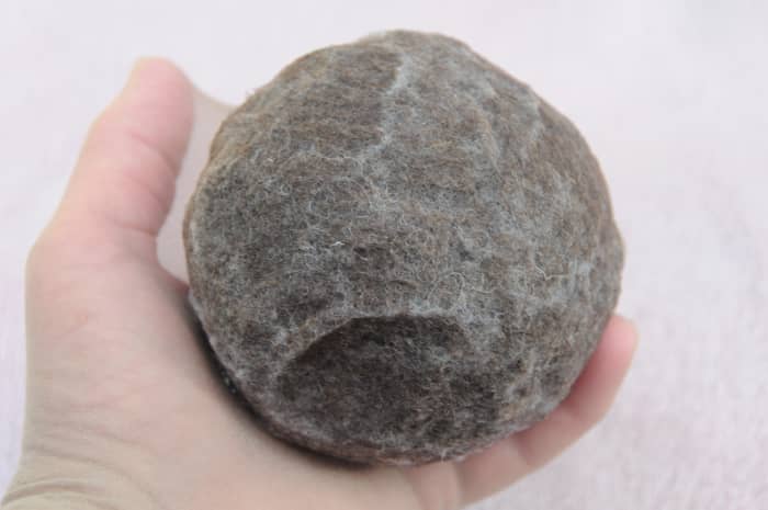 The wet ball ready to be put inside a pair of cut off tights before putting inside a tumble dryer.