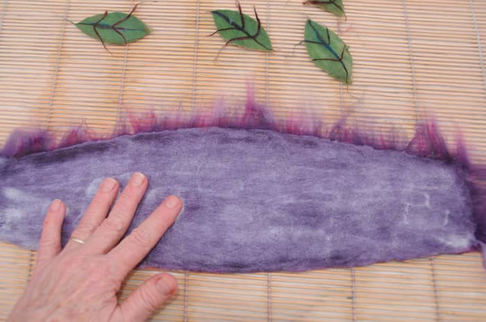 Rubbing the surface of the brim but avoiding the loose fibers on the inner and outer edges.
