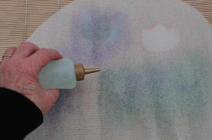 Wetting the covering to facilitate easier rubbing. Bubble wrap may be used instead of foam.