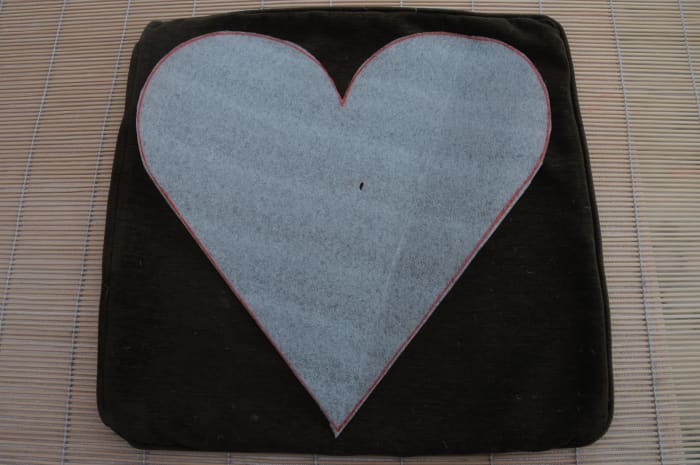 The heart should almost cover the cushion you will be using. It will shrink during the felting process.