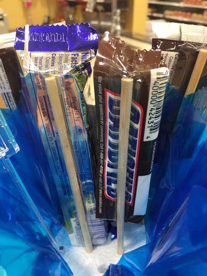 Here's a close-up view of the back side of the candy bamboo skewer. Notice how a piece of tape helps keep the candy in place.