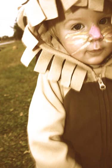 Don't fret if your child is not smiling, sometimes you just got to roll with the punches and take what you can get! Check out how adorable this sappy lion is!
