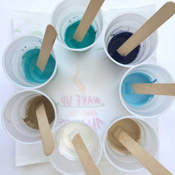 Cups of paint with glue