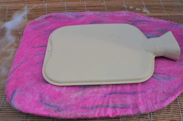 A 'pinch test' reveals that the fibers no longer move under your fingers. Further shrinkage is required either in a tumble dryer to as described above.