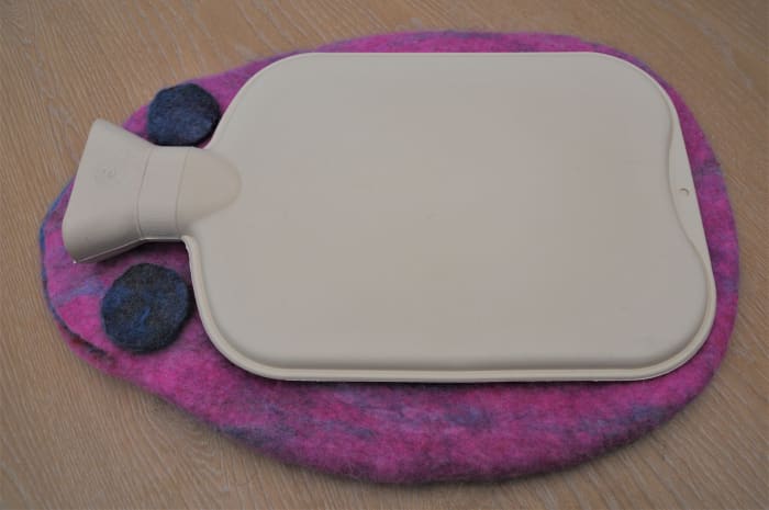 2 Felt pieces (left over from a previous project) can be cut into rounds and placed on each side of the neck of the water bottle.