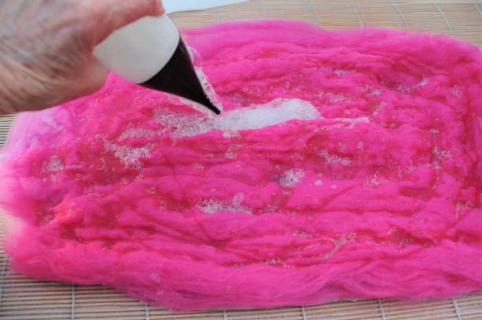 Cover both sides of the template as before. Repeat until you have 3 even layers of fiber on both sides.