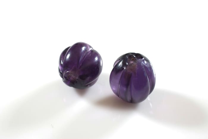Chinese glass “squash” or melon beads from the mid to late Manchu Dynasty. Processed with Helicon Focus.