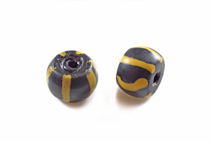 Powder glass trade beads from the mid to late American fur trade era. Processed with Combine ZP.