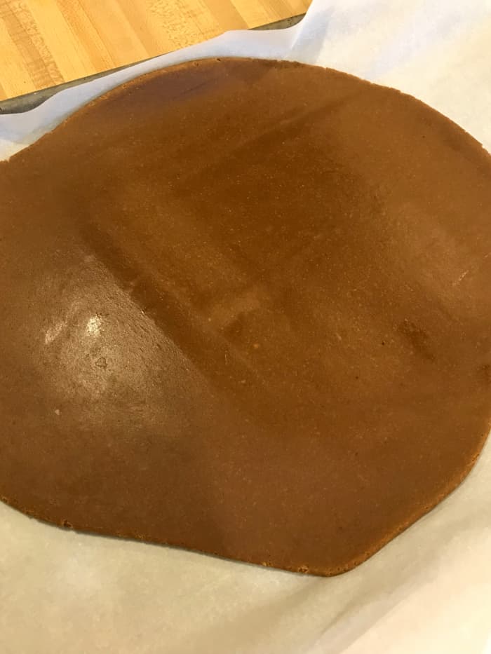 Roll the dough to about 1/4-inch thick. This part isn't exact, so don't worry too much. You do want a nice sturdy cookie for the ornament, so don't roll too thinly.
