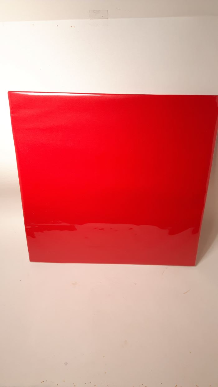 I made a cookie board out of cardboard and wrapped it with red wrapping paper and basket wrap.