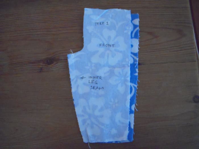 One front and one back piece with right sides together. Inner leg seam is the shorter seam.