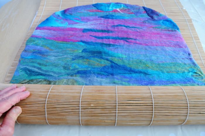 Roll inside a bamboo blind until the surface fibres cannot be pinched between the fingers.