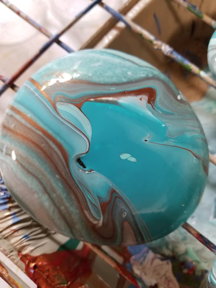 This is my first paint pour. It's an example of the marbling method or paint pouring using acrylic paint.