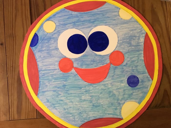 Red and yellow Sharpies were good for the outside circles so were not covered with felt. My picture was colored because Plan A did not work! Draw the designs on the poster board with pencil and outline with black marker so they are easy to trace.