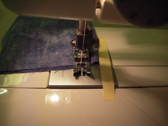 At the end of the seam, put the machine in reverse and sew a couple of stitches to lock the end of the seam.
