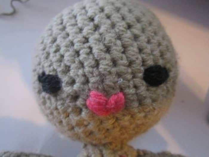 I wanted this mermaid to have a pop diva kind of look. I made her lips by stitching a "V" and going over it a couple times. Here eyes are ovals with little "v" eyes lashes on the side.