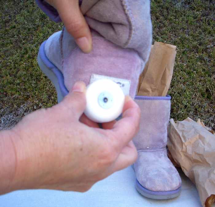 Rub wax over back labels on boots so they don't take up too much dye. I used an old votive candle.