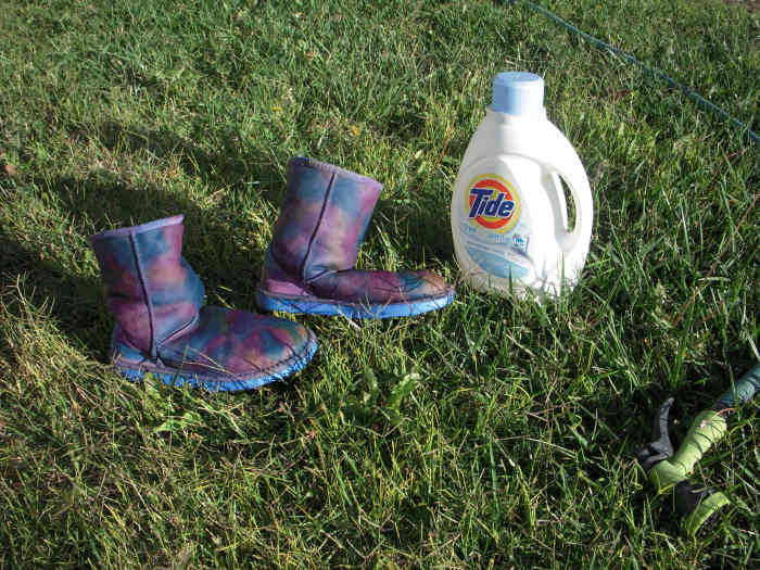 Wash the outsides of the boots with a little detergent and then rinse very well - inside and out - until the water runs clear. I used a garden hose.