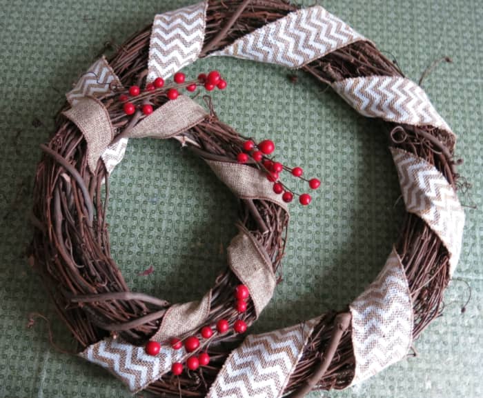 Next, decorate your larger wreath, except for the area where the two wreaths overlap.