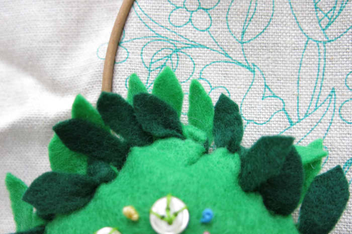 To finish your no-sew pincushion, cut each piece of fringe to look like a flower petal.