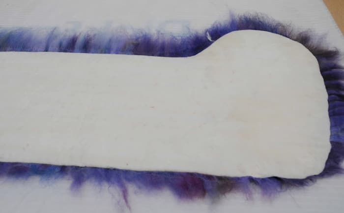 Cover the white layer in fibers which have been pulled from the lengths of roving as per normal procedure.