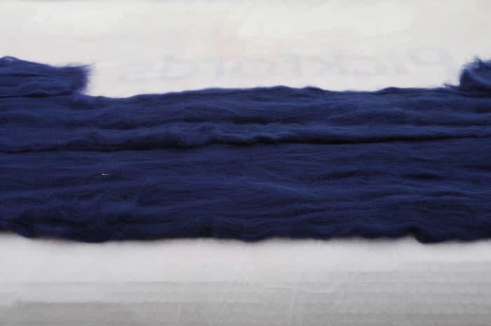 Pull out the fibers from lengths of roving and put down onto the template, repeat on the other side.