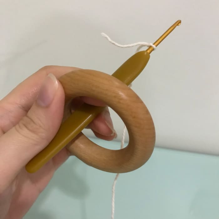 After making the slip knot, insert the hook through the ring from the back so the working yarn is at the back of the ring.