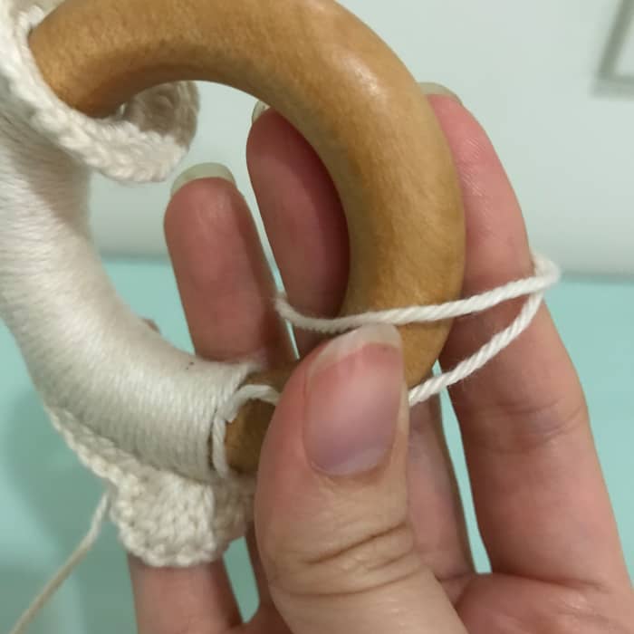Do the loops you normally do for making a magic ring with the wooden ring acting as one of your fingers.