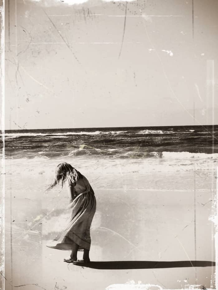 "Daughter." This image of my daughter on the beach was changed into a sepia image. The effect was startling. The original image is bright and colorful, while this one looks nostalgic. Experimentation with imagery is always a welcome exercise.