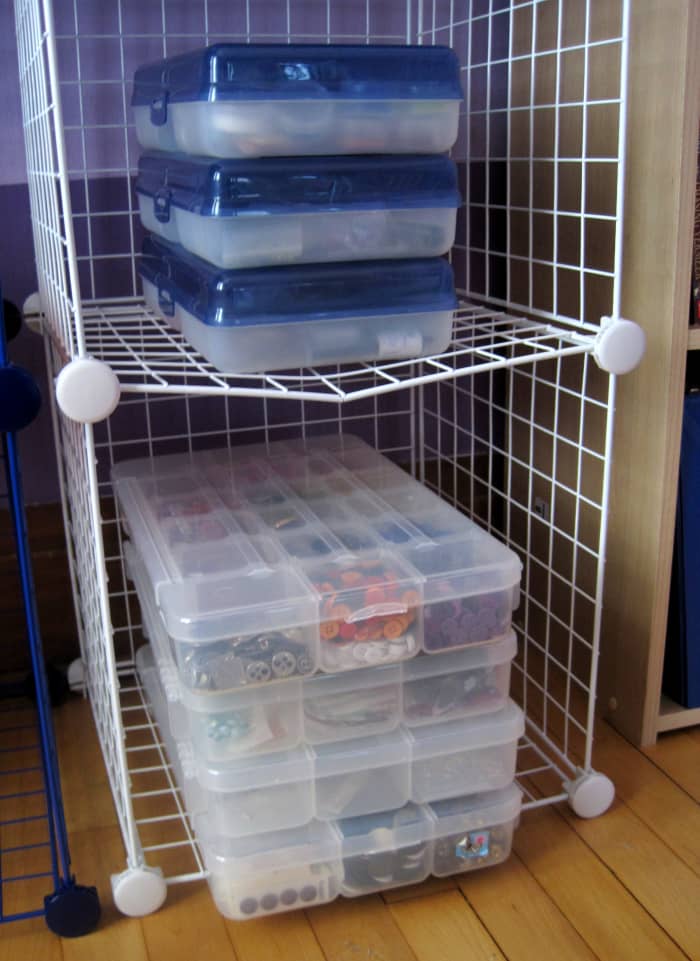 I store all of my beads, buttons, and findings in plastic craft organizers or plastic containers.