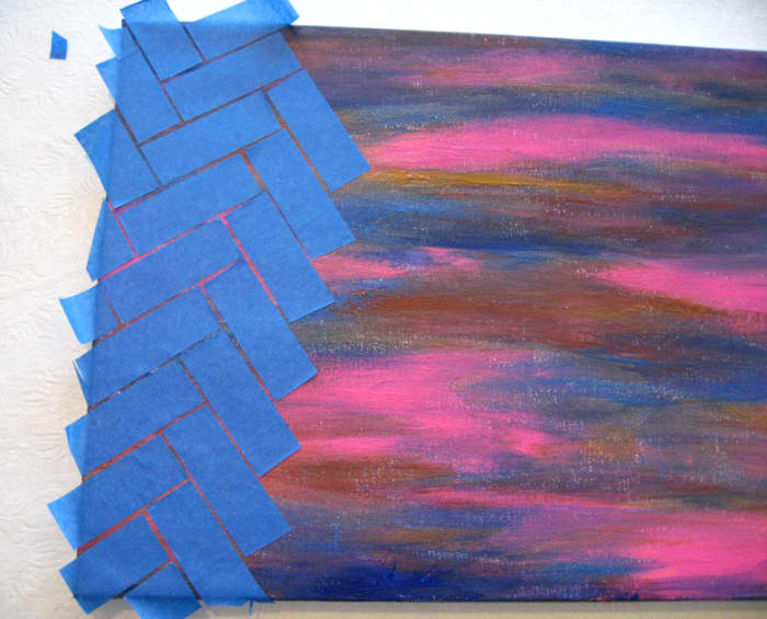 Apply tape creating a zig-zag pattern. Look at the corners of the rectangles of tape, and make sure they align as in the picture.