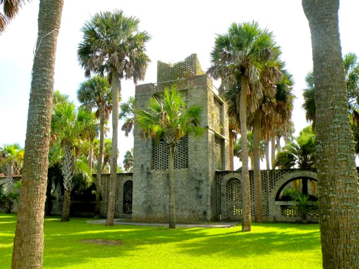 The 40-foot tower, used for water storage, stands in the middle of the walkway that bisects the courtyard. "Atalaya" is a Spanish word meaning "watchtower." This piece of architecture inspire the name of the winter home.