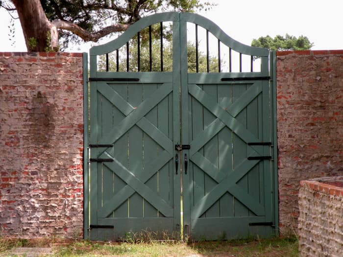 Gates and doors were all designed by Anna. This one is in the entry courtyard and opens out onto grassy lawns.