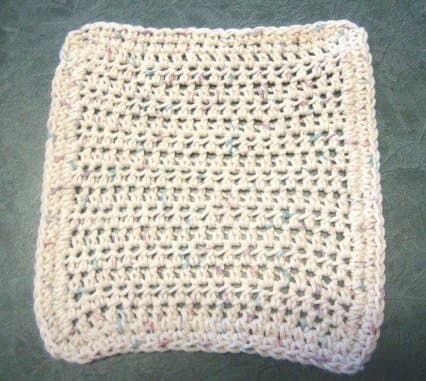 "Even with two rows of single crochet for edging, I'm still as plain as powder, but hey . . . the counters love how well I clean 'em."