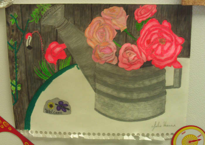Here I completed coloring in the welcome sign, and I am beginning to color in the green table cloth.