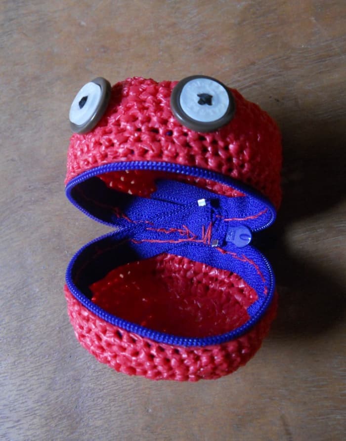 The upper part, where the button eyes are sewn, is PART A. The bottom is PART B. They are joined together with 8 sl sts.