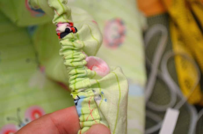 Pull the elastic all the way through the sleeve then sew the opening shut and you're done.