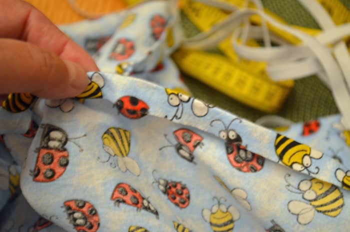 To sew the elastic on top of the hem, use the same technique as above to hem the sheet—turn under fabric once and iron the hem.