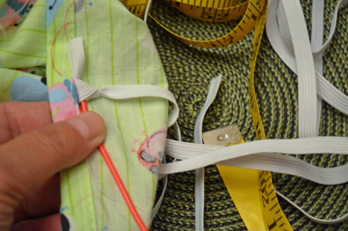 Thread elastic through the sleeve with either a safety pin or a plastic threader.