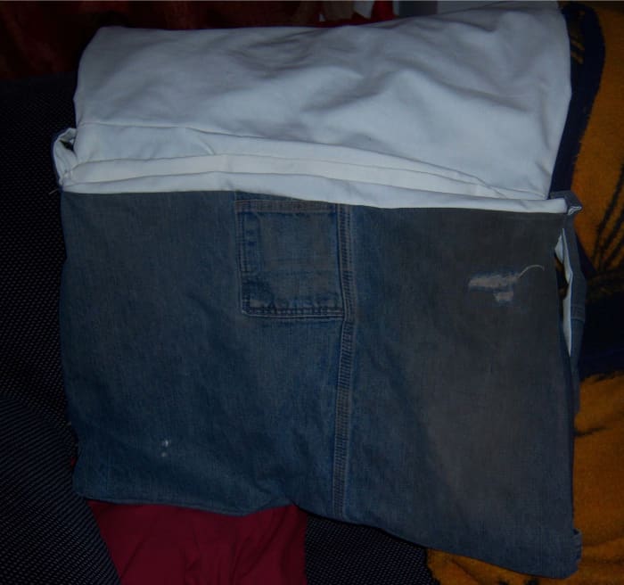 That little pocket is perfect for holding a cell phone. The bag itself holds quite a bit of stuff.