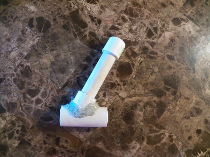 The hopper: Cut T and angle it before gluing it again. Attach PVC pipe (any length) and end cap.