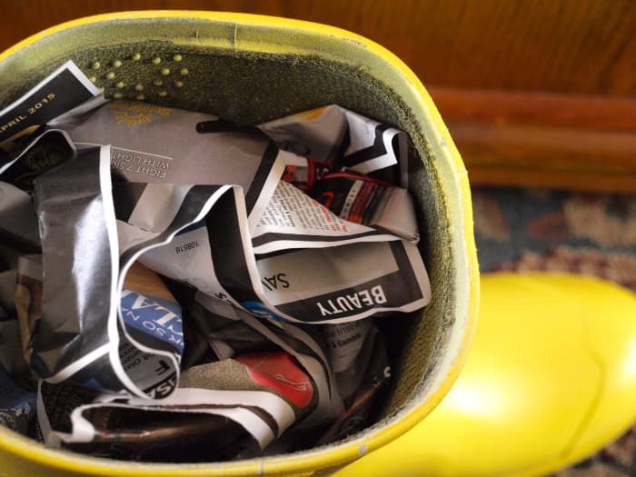 For some stability while painting, fill the boot with old paper before adding your design.