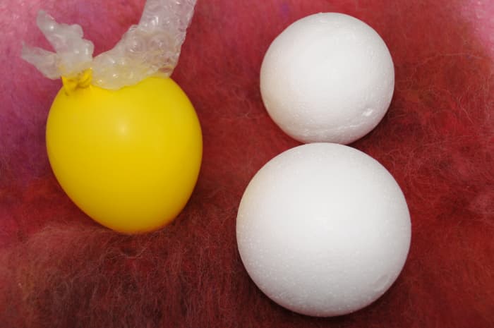 Comparing Balls to Balloons. A piece of Bubble-wrap is shown tied up inside the knot.