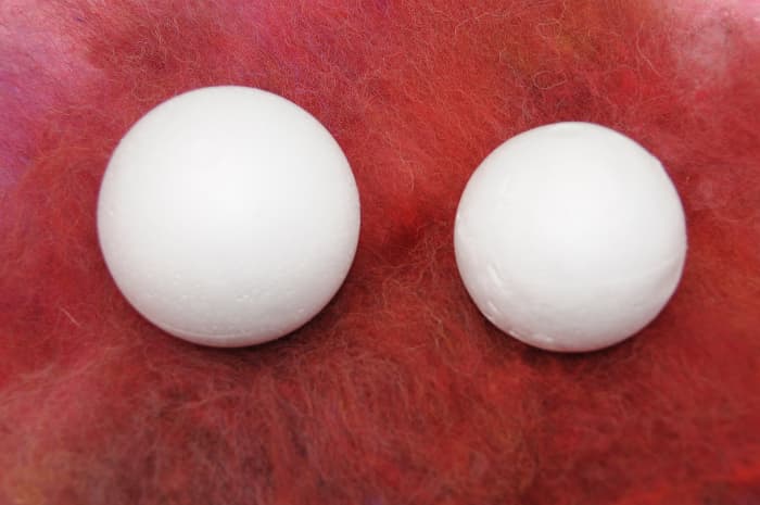 Two polystyrene balls. This image gives one an idea of the amount of shrinkage which is likely to take place.