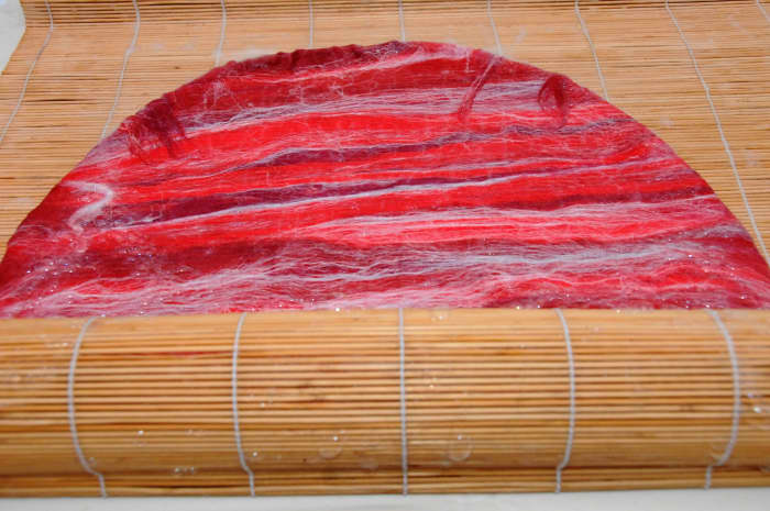 Roll inside a bamboo blind and rotating the direction in which you roll the project.