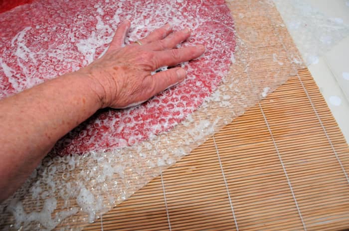 Neaten the edges so that the fibres are resting right up against the template edges.