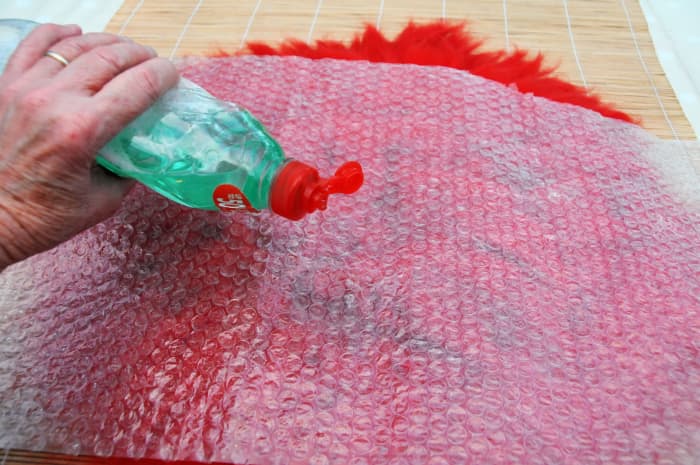 Add a little hot soap to the water to allow your fingers to glide over the surface smoothly.