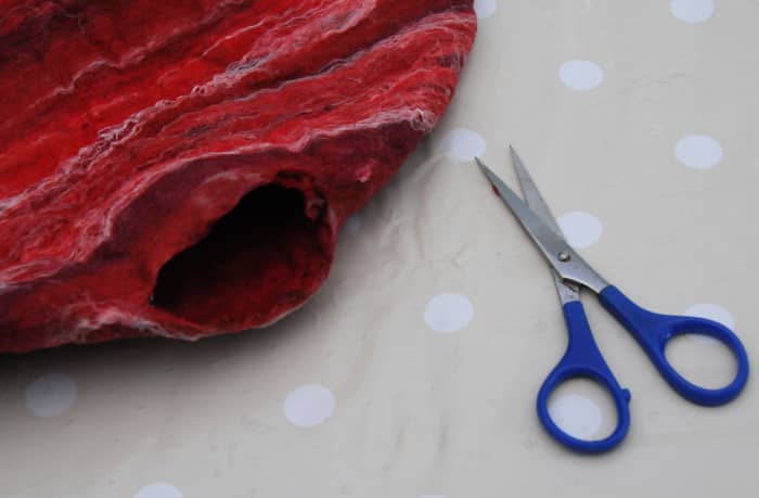 Cut a small hole into the side so as to be able to extract the template from the bag.